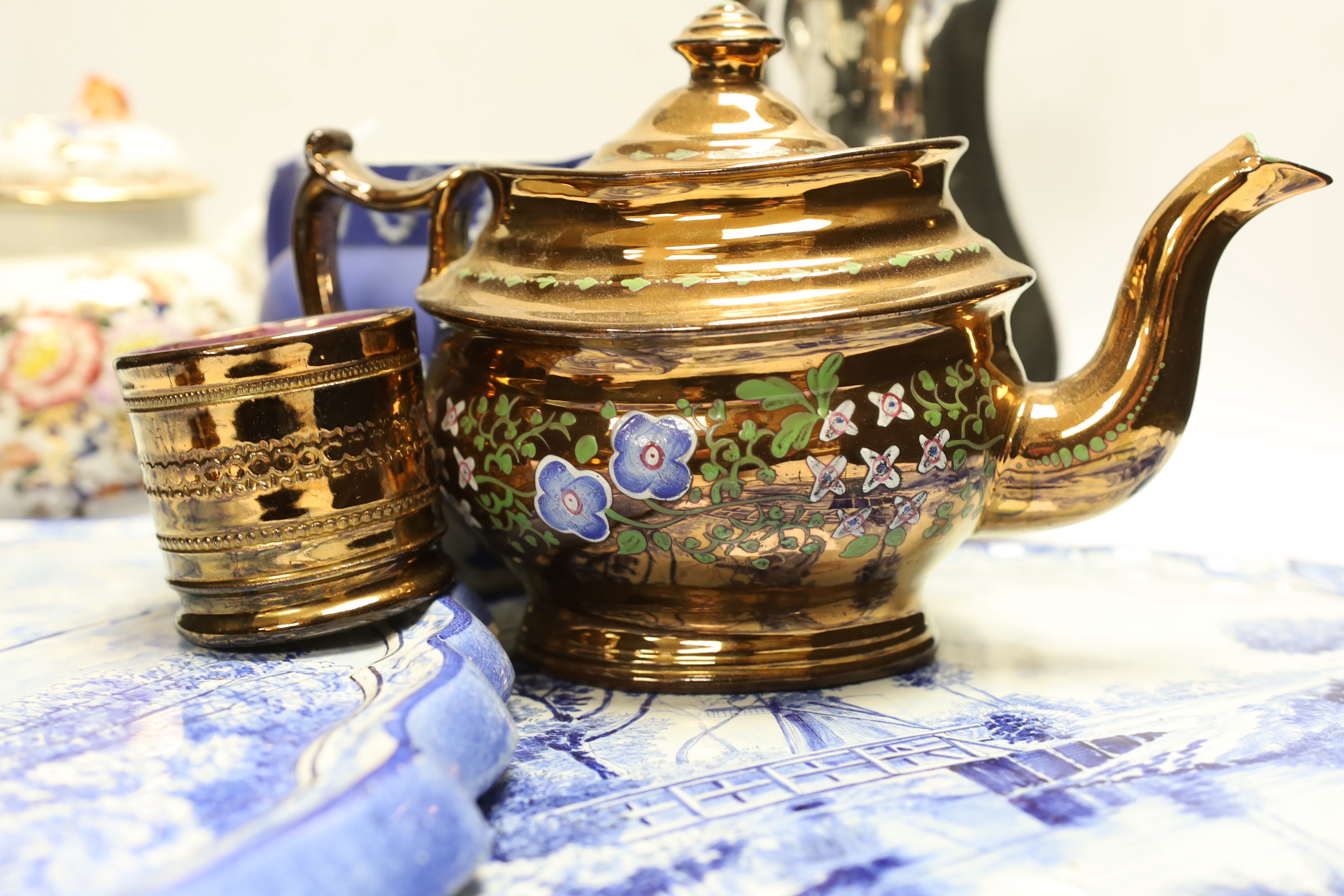 Nine ceramic items including two Dutch blue and white wall plaques, a silvered jug, a teapot, four items of lustreware and a Wedgwood jug, tallest 23cm
